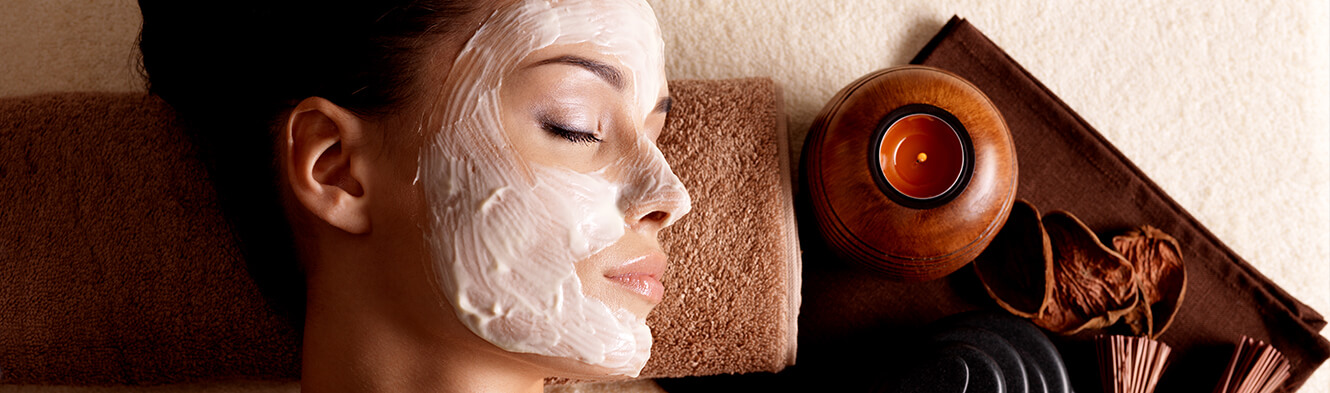 Woman lying down with facial mask